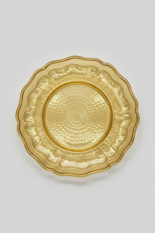 Handcrafted gold hammered metal plate, decorative scalloped edge, perfect for serving or home decor.