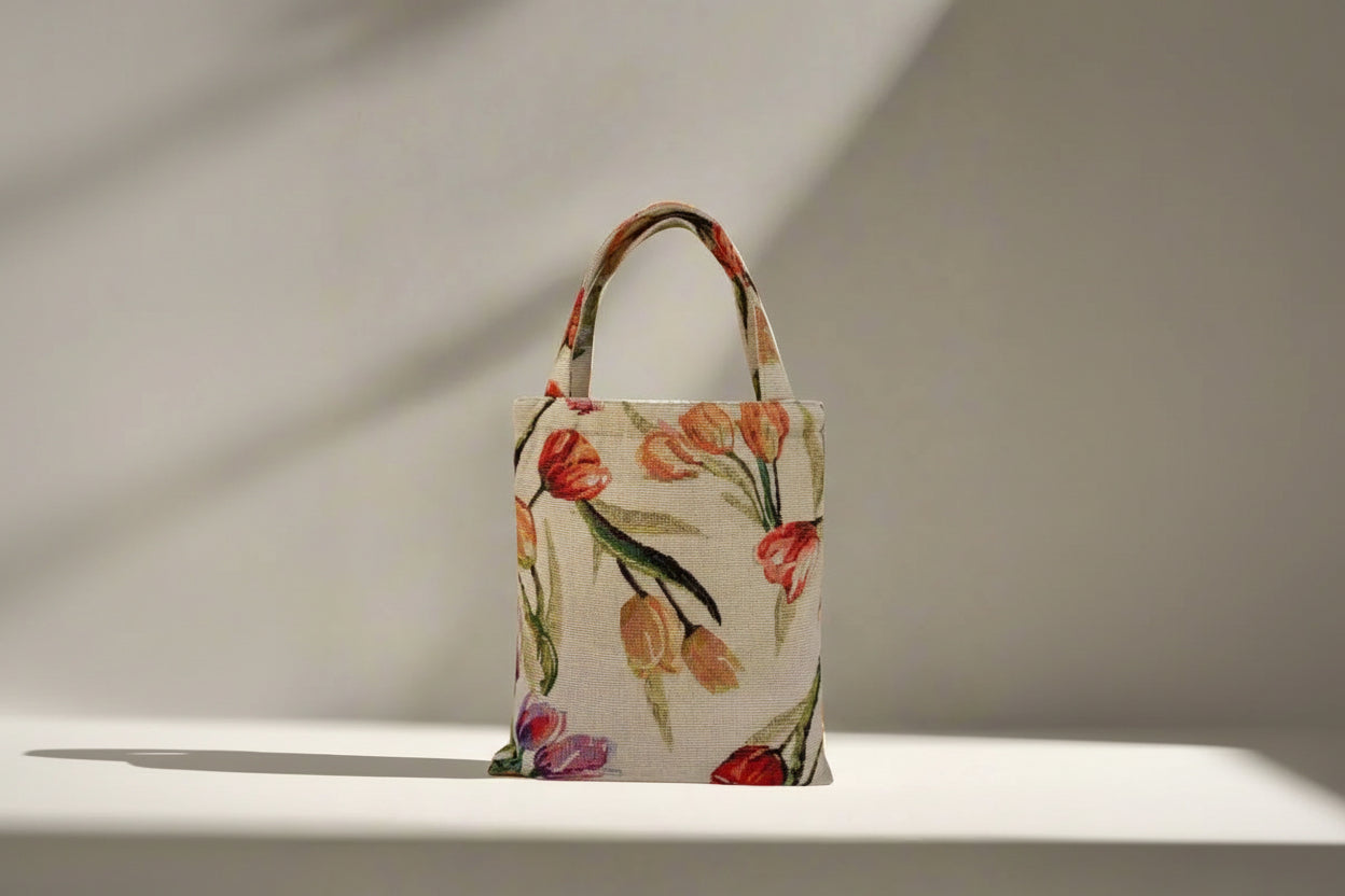Floral-patterned handbag on a neutral background