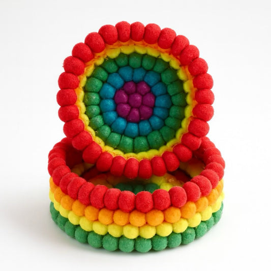 Colorful felt coasters set in rainbow design, featuring vibrant red, yellow, green, and blue hues.