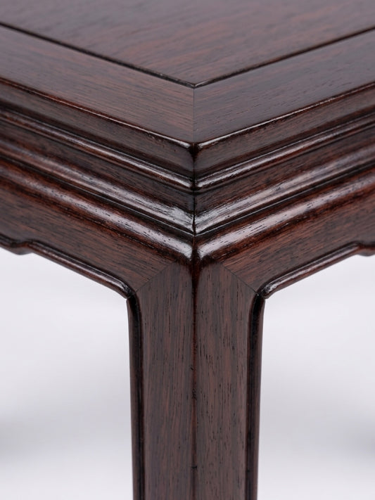 Square dark hardwood Ming-style low table up close corner detail view