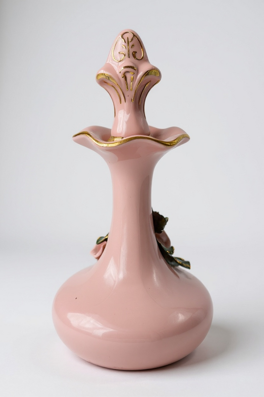 Elegant pink porcelain vase with gold accents and floral design, perfect for home decor.