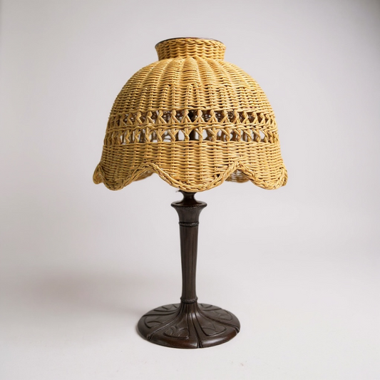 Lamp with a wicker shade on a white background