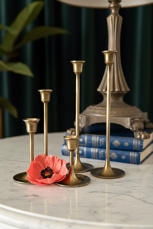 Decorative table setting with candle holders, flowers, and decorative items.