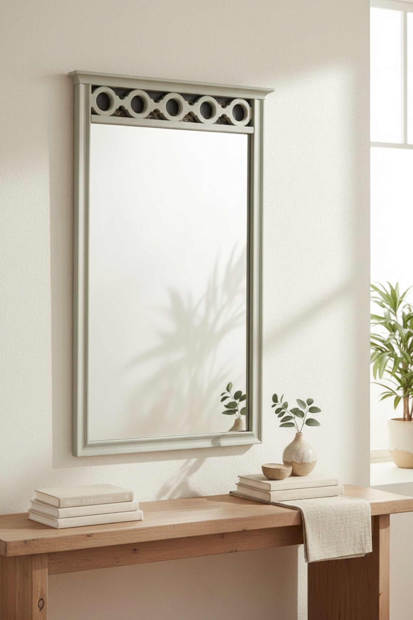 Elegant rectangular mirror with a light green frame and decorative circular top, perfect for modern decor.