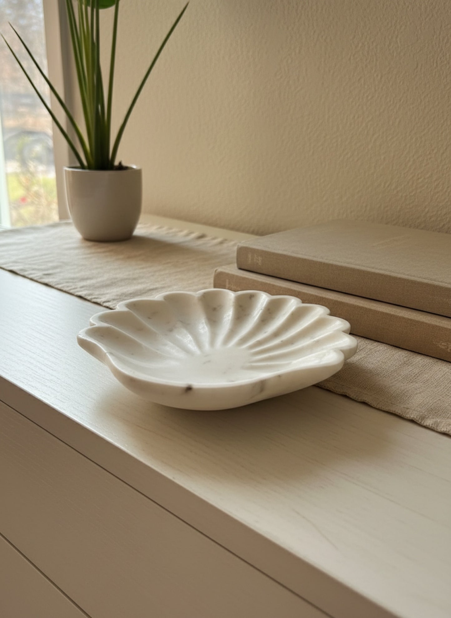 Marble shell coastal dish staged