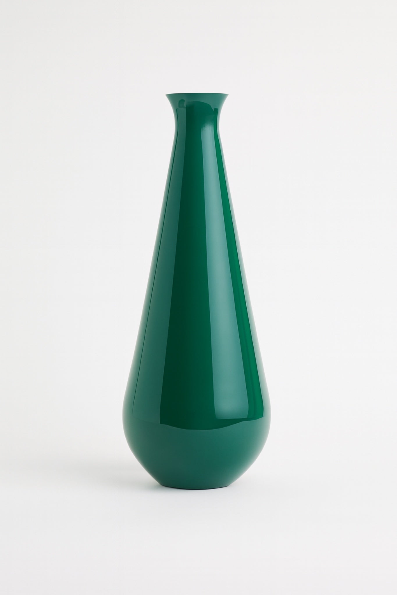 Modern glossy green vase with smooth reflective enamel finish, standing upright on a white backdrop.