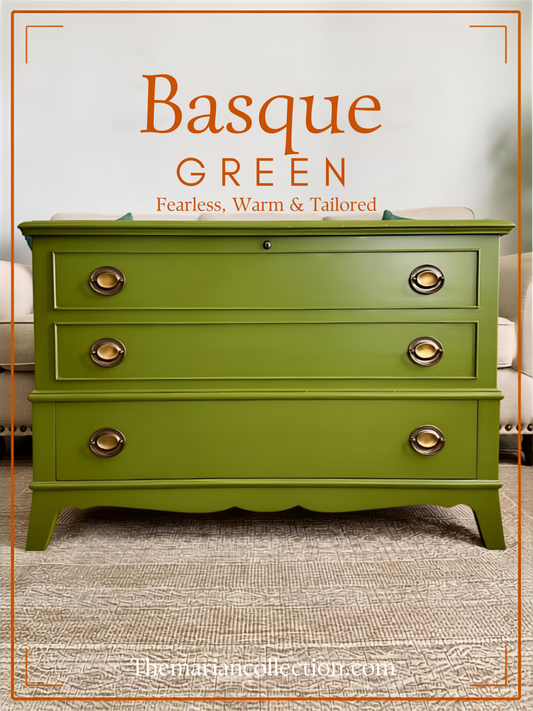 Refinished vintage dresser painted in Sherwin-Williams Basque Green with aged brass oval handles, styled in a living room. Text overlay reads: "Basque Green: Fearless, Warm & Tailored - Themariancollection.com.