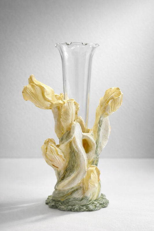 A 1960s vintage Japanese sculptural ceramic bud vase featuring dimensional, hand-painted pale yellow iris petals and green stems that wrap around a clear, removable fluted glass insert, styled against a neutral studio background.