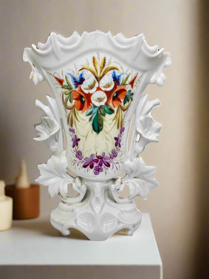 Close-up detail of antique German Rococo Revival porcelain vase circa 1880 showing overglaze enamel hand-painted floral motifs with age-appropriate gilt fading and authentic antique patina on white porcelain body