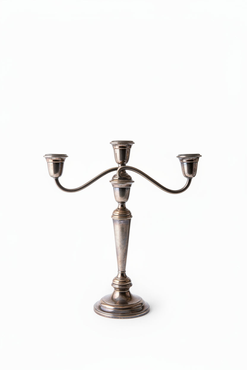  Close-up of base of Gorham Newport silverplate candelabra showing stamped maker's mark reading NEWPORT SILVERPLATE YB 586/1 with warm oxidized patina on polished metal