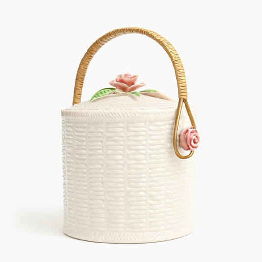 Elegant white basket with pink rose lid and woven handle, perfect for decor or storage.