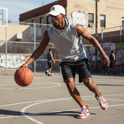 White cap with colorful 'Power Coffee Drinker' text on a white background on man of color playing basketball in the city
