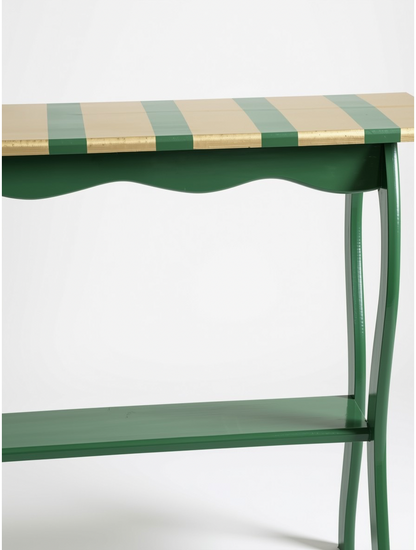 Close-up front view focusing on the smooth, scalloped wood apron and elegant, fluid leg attachment of the hand-painted artisan statement table.