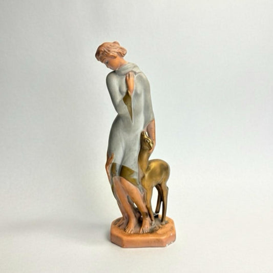 Statue of a woman with a deer on a light gray background Art Deco Goddess & Fawn Chalkware Figurine – Mid-Century Modern Sculptural Decor