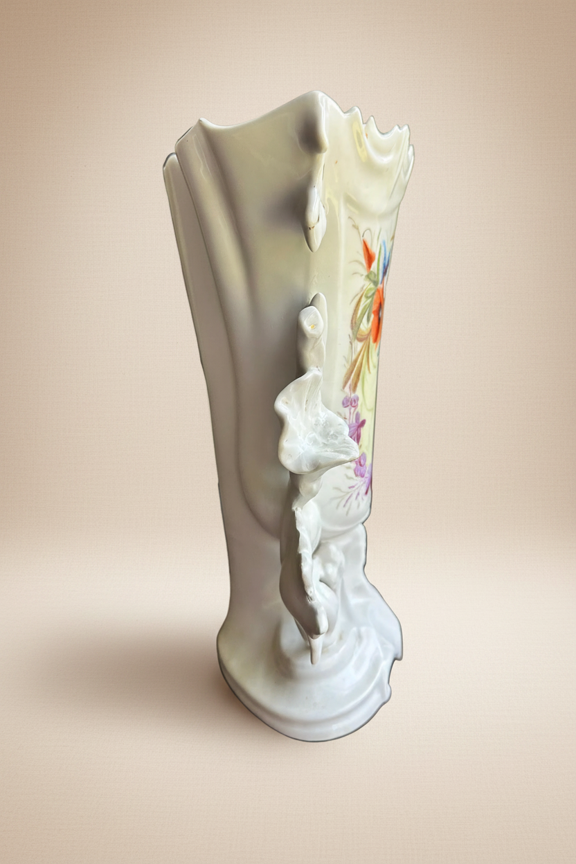 Side profile of antique German Rococo Revival porcelain vase c.1880 — white body with sculptural acanthus relief and hand-painted jewel-tone floral decoration visible at edge