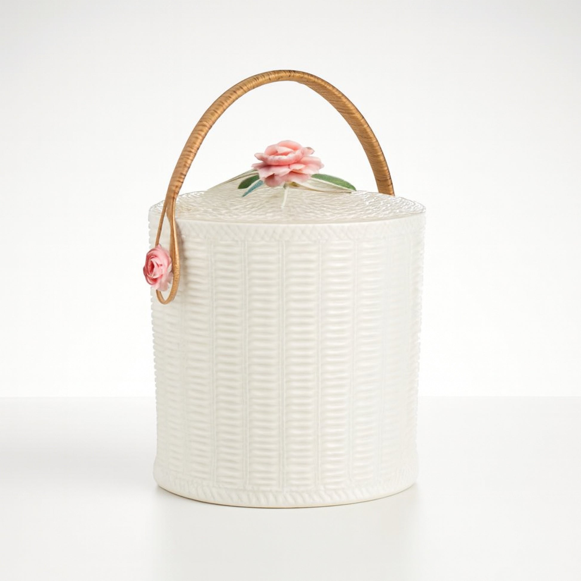 White decorative storage canister with a rose handle, intricate texture for home decor.