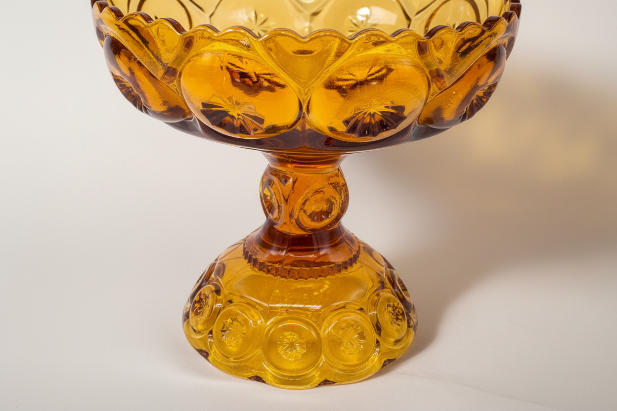 Base of amber Indian glass company intricate detail Candy dish