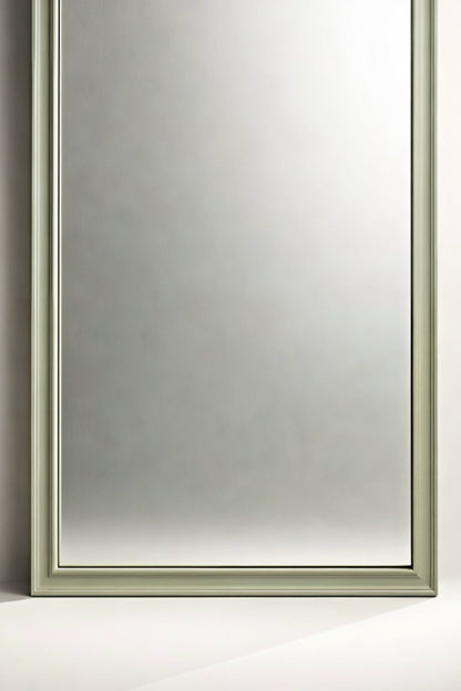 Elegant rectangular mirror with a soft green frame, perfect for modern home decor.
