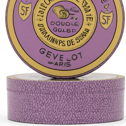 Purple container with gold accents and visible branding on a white background