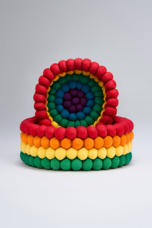 Colorful handmade felt stacking toy in rainbow hues, perfect for kids' sensory play and development.