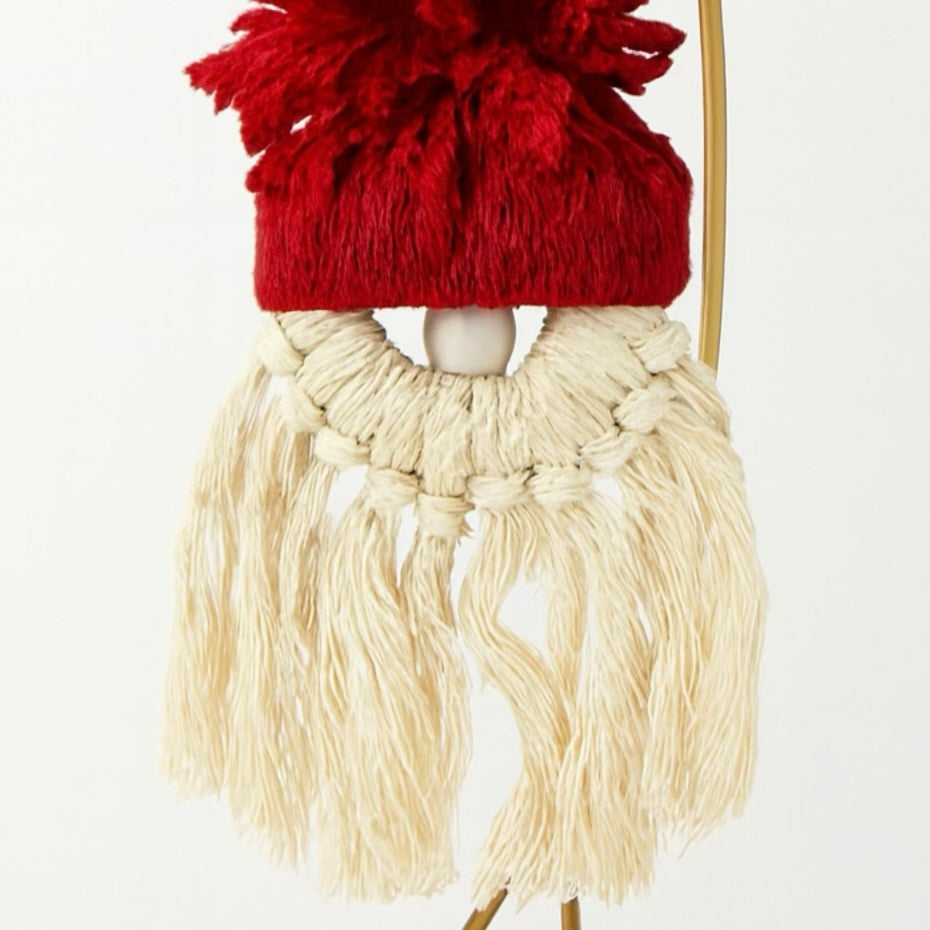 Decorative gnome with red hat and beige beard on a white background