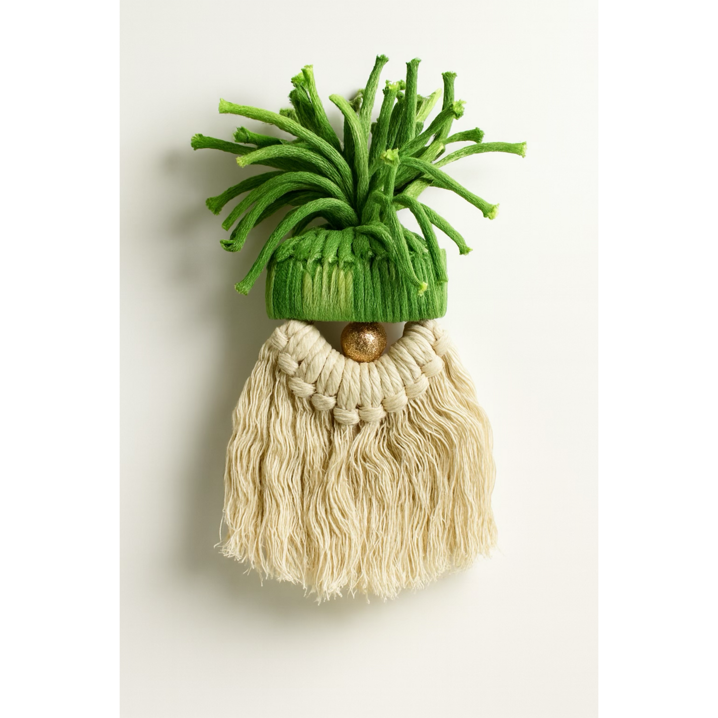 Decorative gnome with green hat and beige beard on a white background