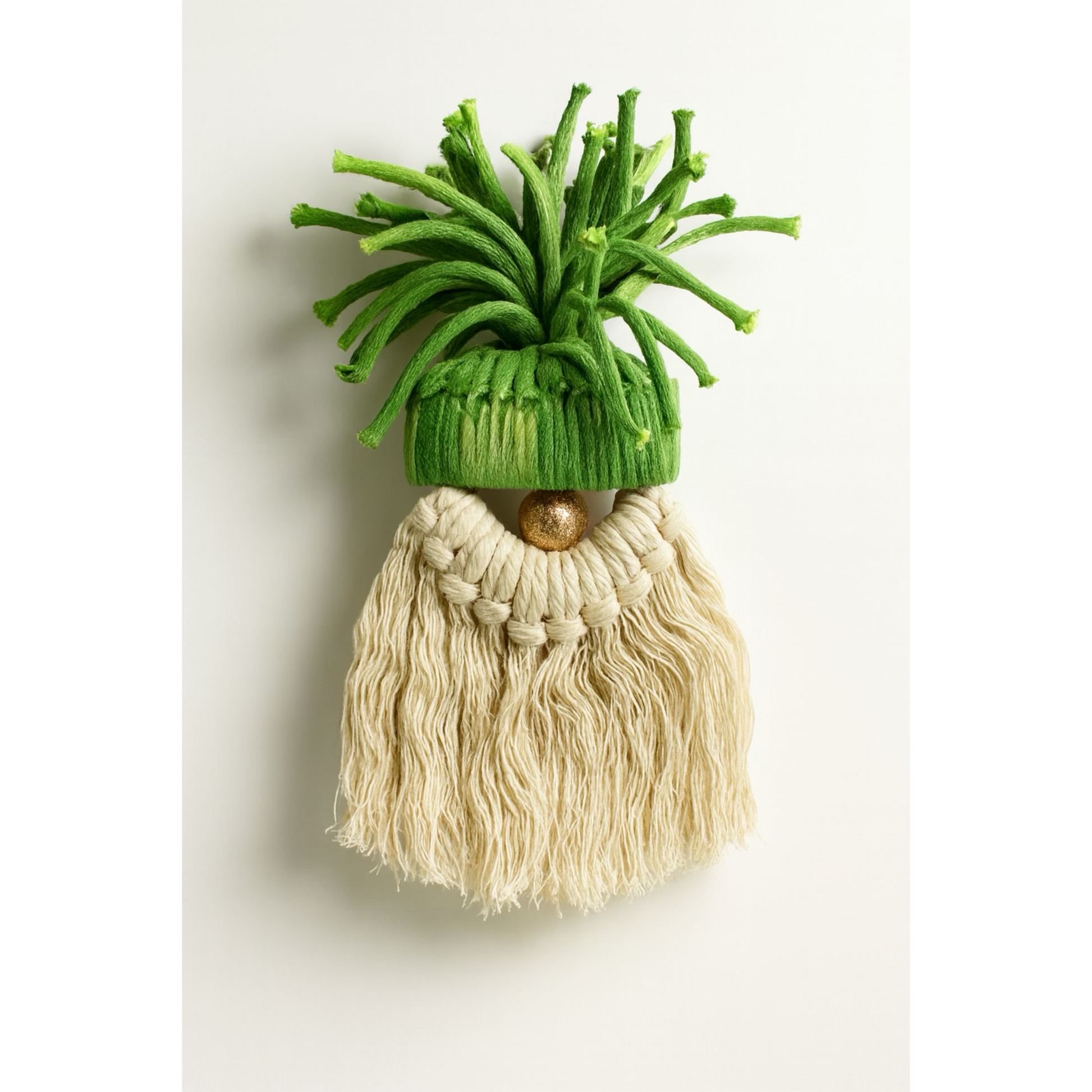 Decorative gnome with green hat and beige beard on a white background