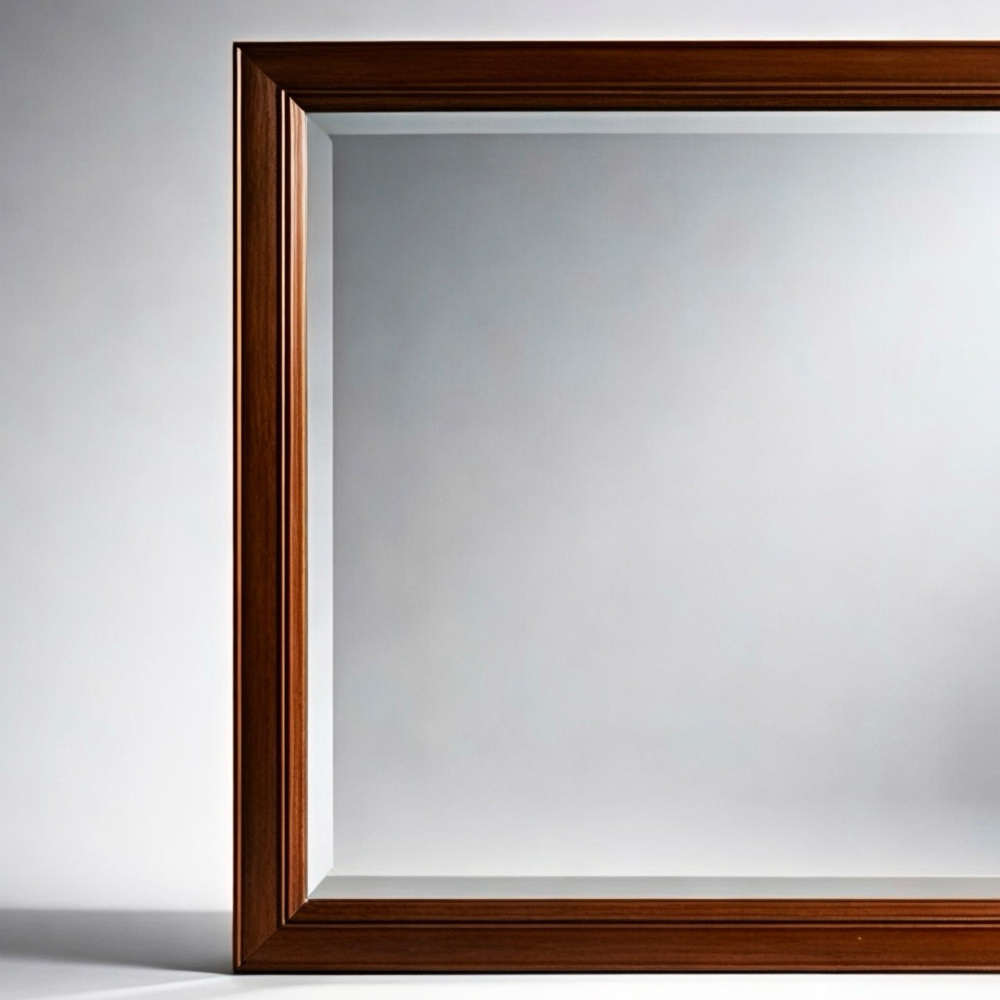 Elegant rectangular wooden mirror with a rich brown frame, perfect for home decor.