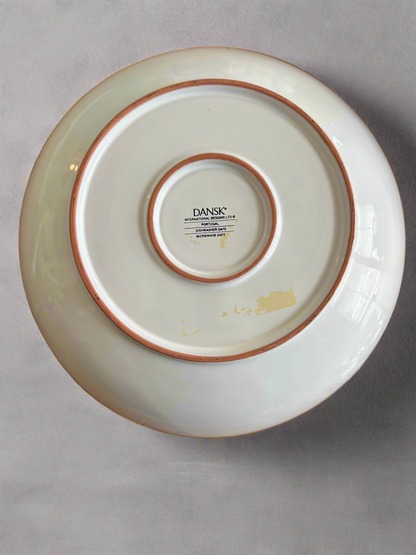 Bottom of Dansk International Designs ceramic dish showing Portugal origin stamp and microwave-safe label, useful for verifying authenticity and provenance