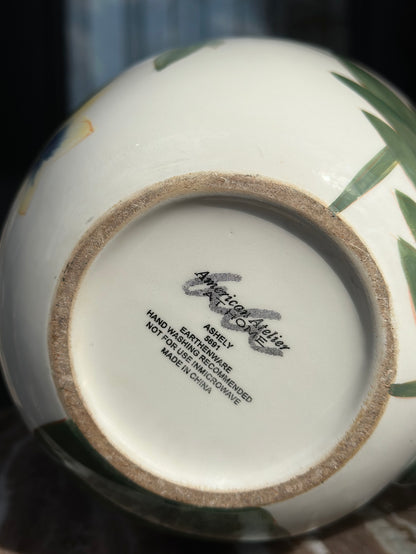 Ceramic product with 'American Artelier' branding on a blurred background