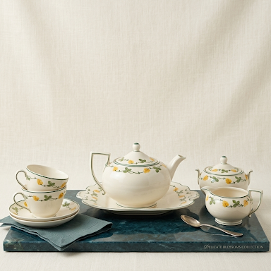The Susie Cooper "Delicate Blossoms" set is such a classic piece of design history.  Eight piece tea set with rare scalloped edge serving plate 