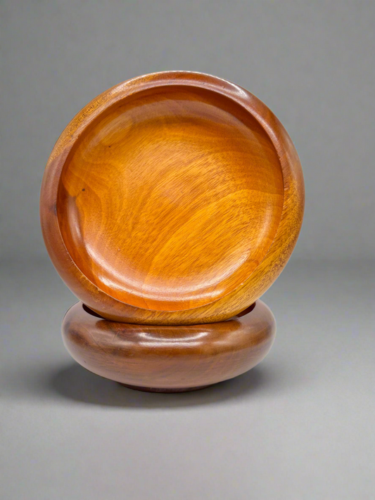 Elegant wooden bowl set, handcrafted from rich mahogany, perfect for decor or serving snacks.