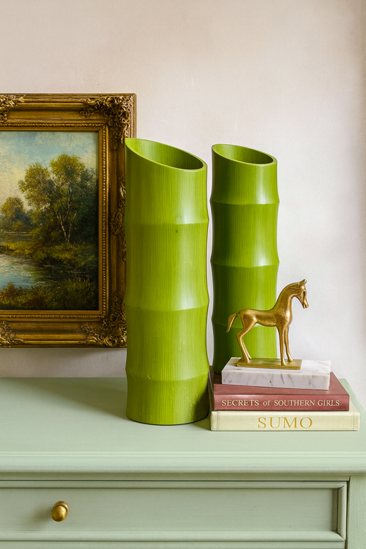 Set of two vibrant green ceramic vases with a modern design, perfect for home decor.