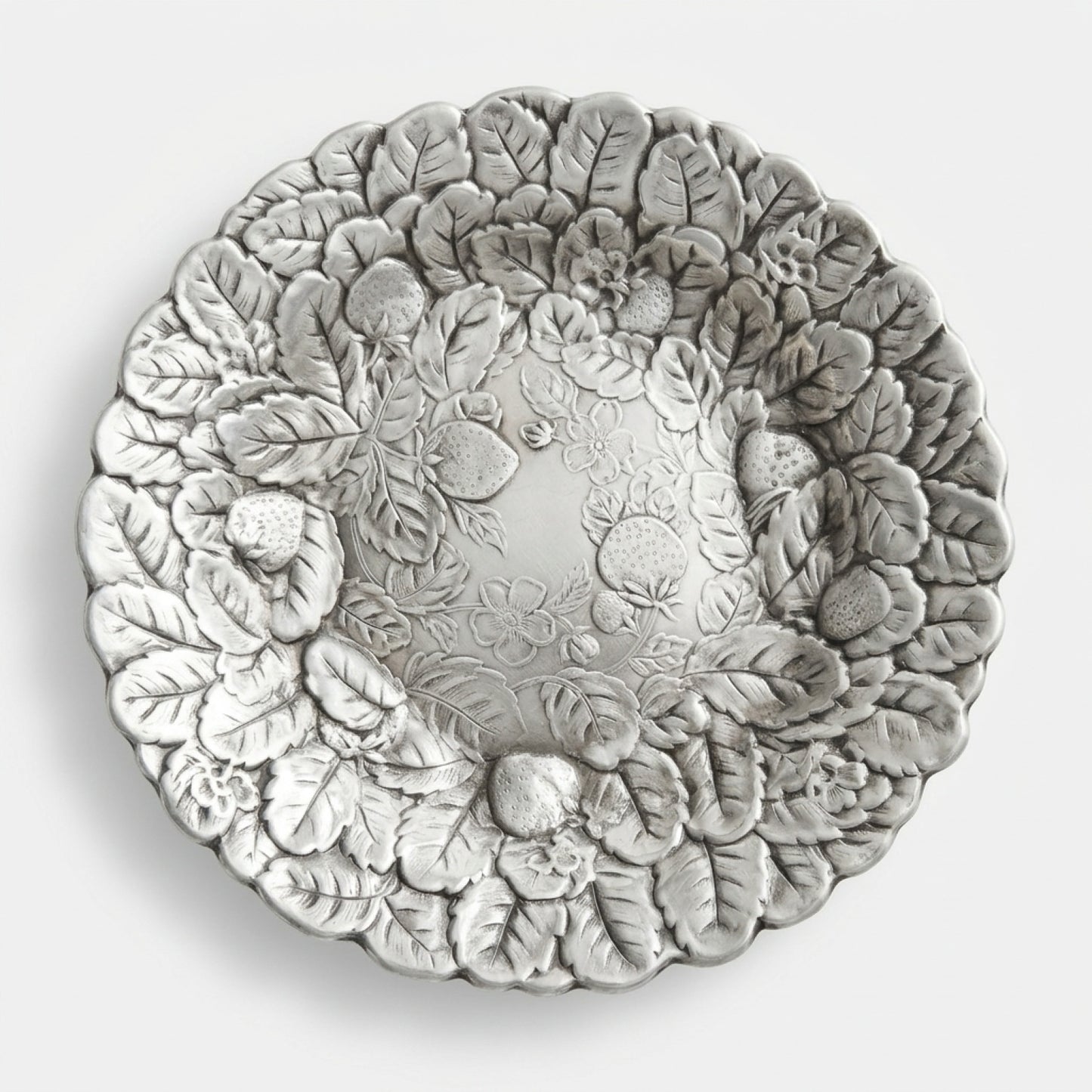 Front facing view of a vintage Reed and Barton 115 strawberry silver plate platter on a crisp white background.