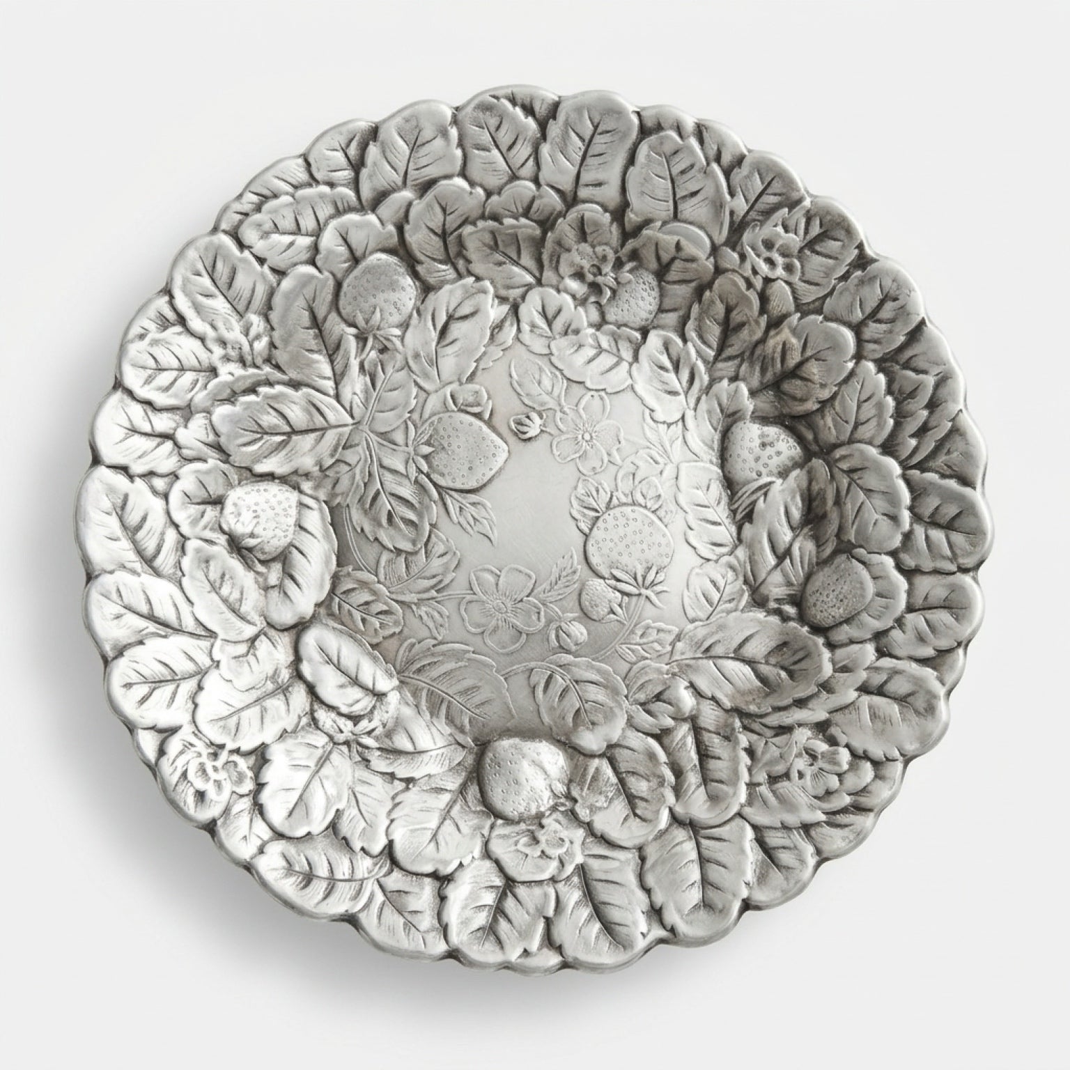 Front facing view of a vintage Reed and Barton 115 strawberry silver plate platter on a crisp white background.