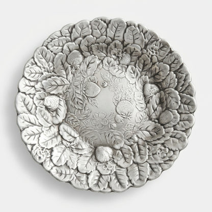Front facing view of a vintage Reed and Barton 115 strawberry silver plate platter on a crisp white background.