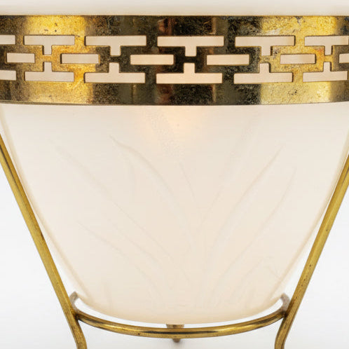 Decorative bowl with gold geometric pattern on a dark background