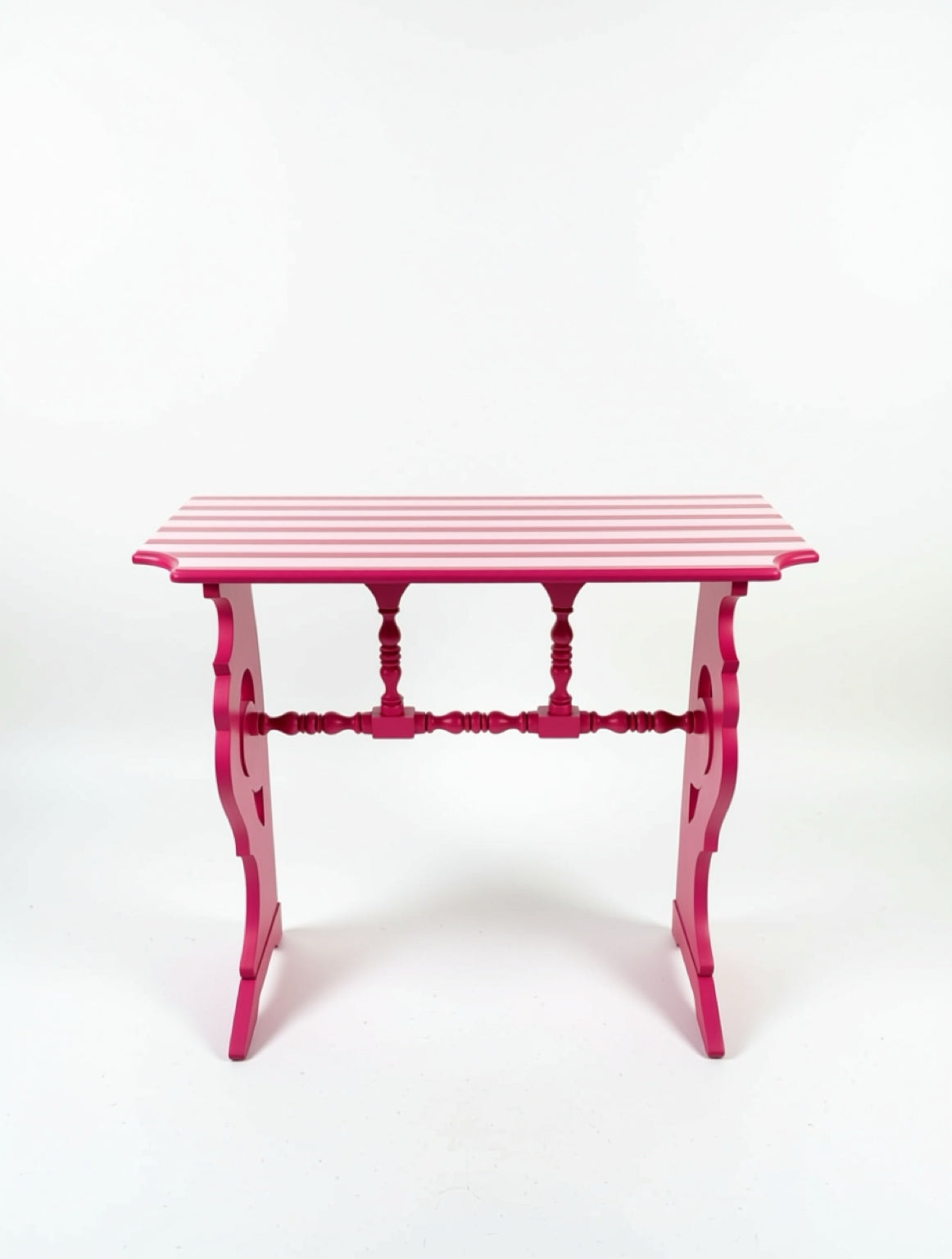 Pink side table with striped pattern on a white background