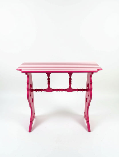Pink side table with striped pattern on a white background
