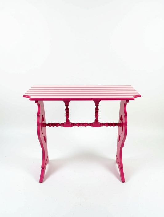 Pink side table with striped pattern on a white background