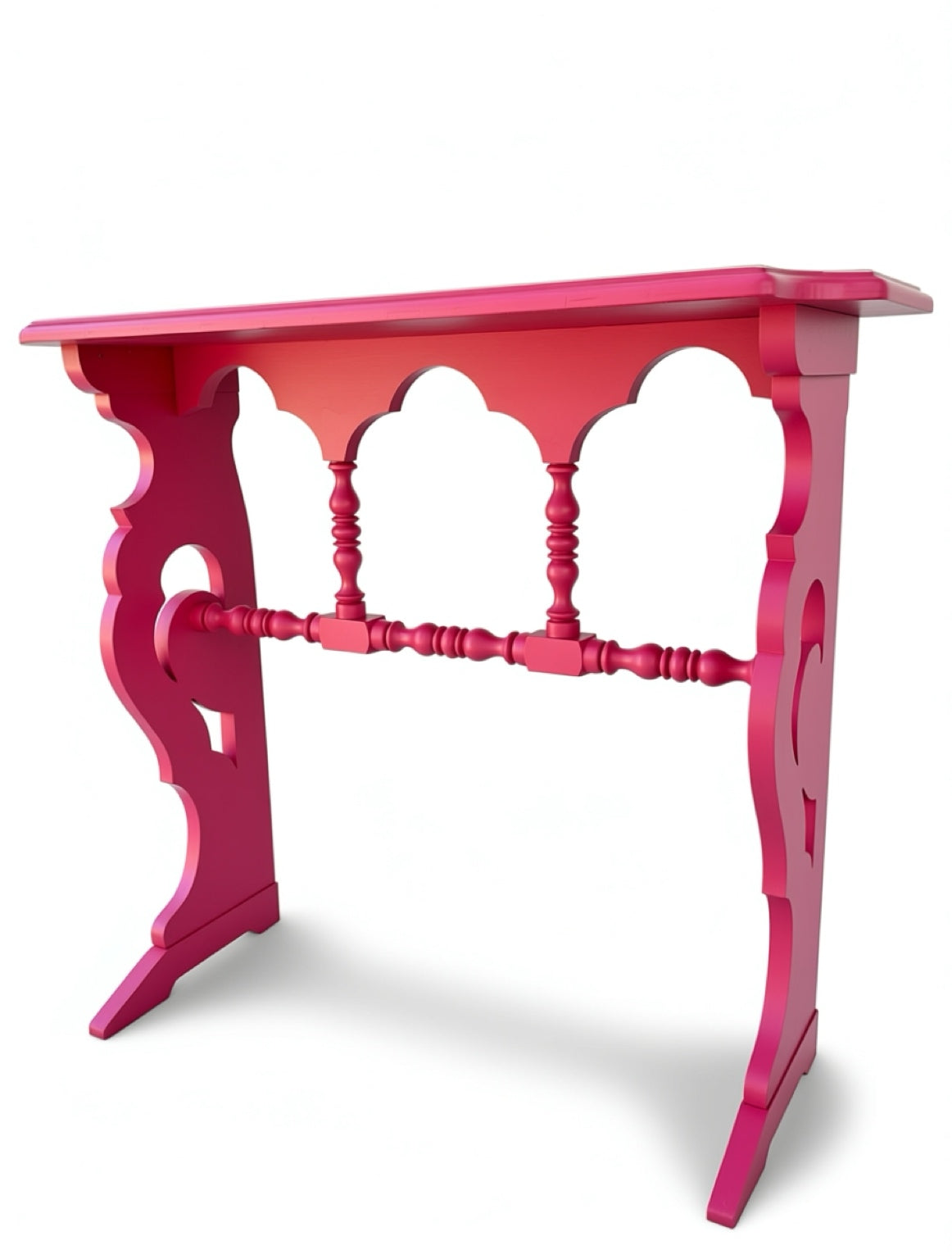 Pink decorative table with intricate design on a white background