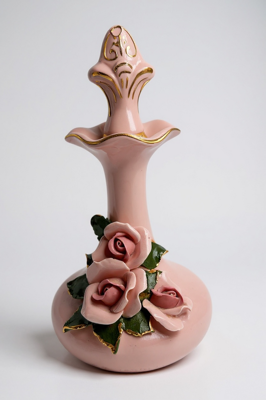 Elegant pink ceramic vase with floral rose accents and gold detailing, perfect for home decor.