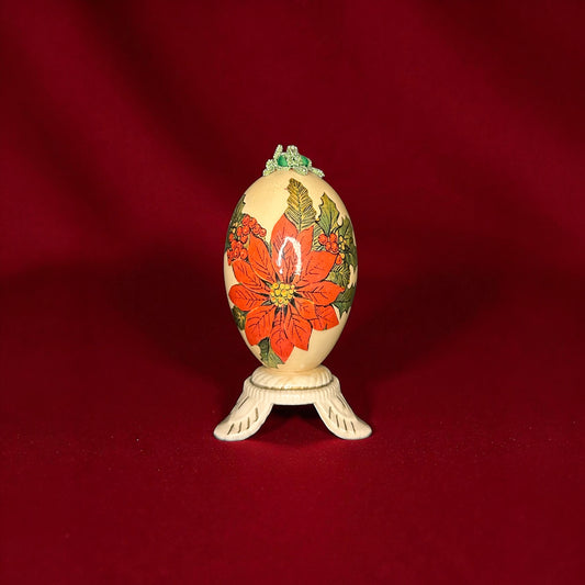 Decorative egg with floral design on a red background