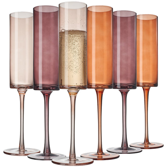 Set of six multicolored champagne flutes on a white background