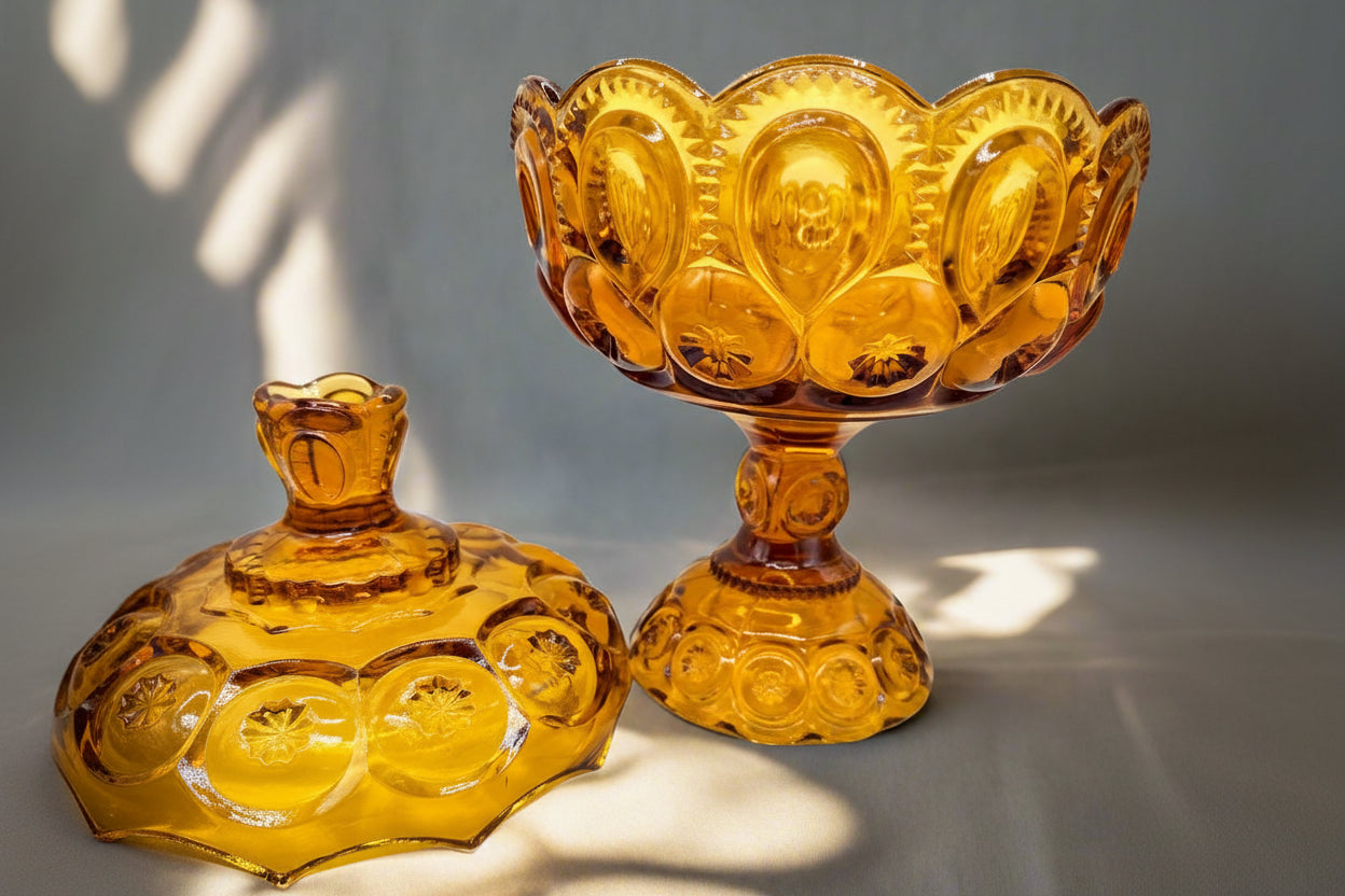 Vintage amber glass dessert bowl and lid, intricate textured design, perfect for stylish serving.