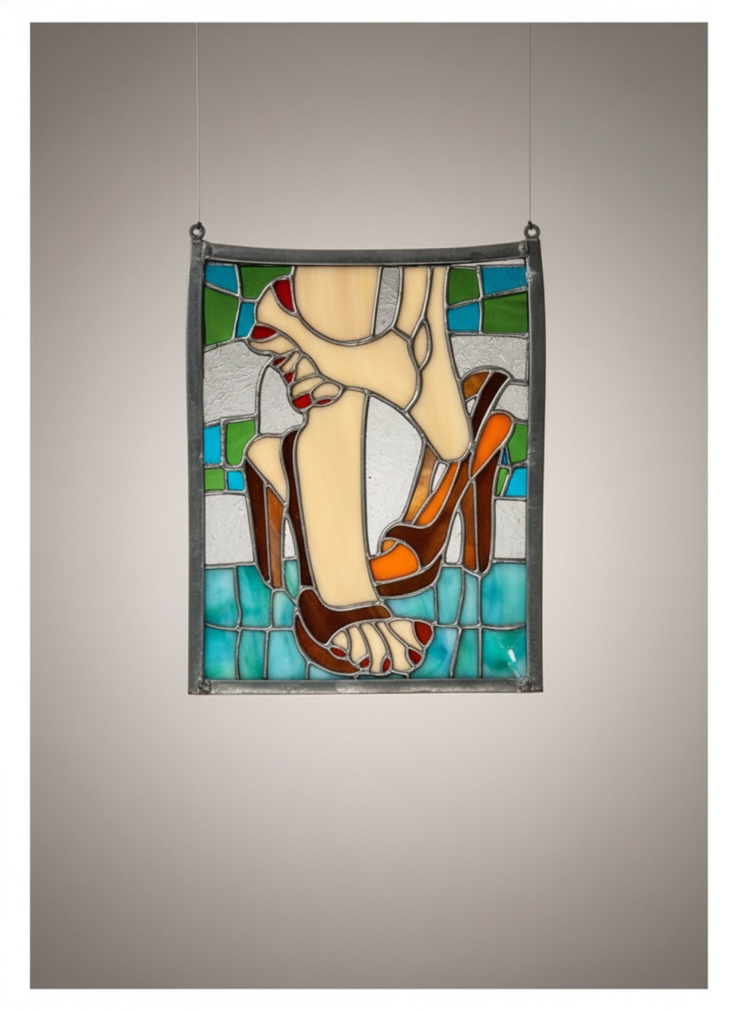 Vintage stained glass decor of feet and high heels featuring blue, white, beige, tan