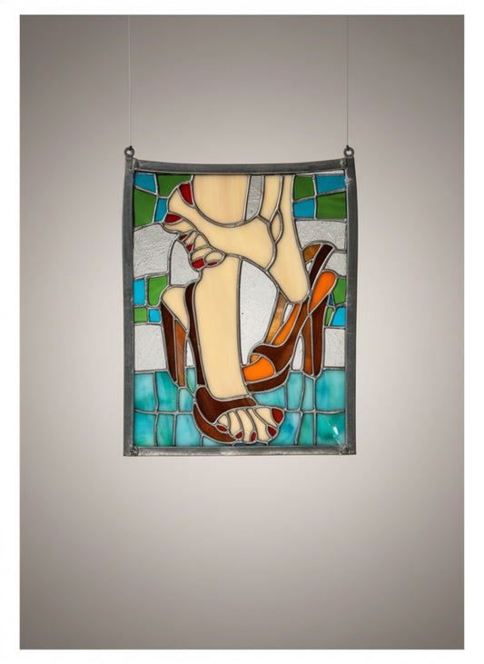 Vintage stained glass decor of feet and high heels featuring blue, white, beige, tan