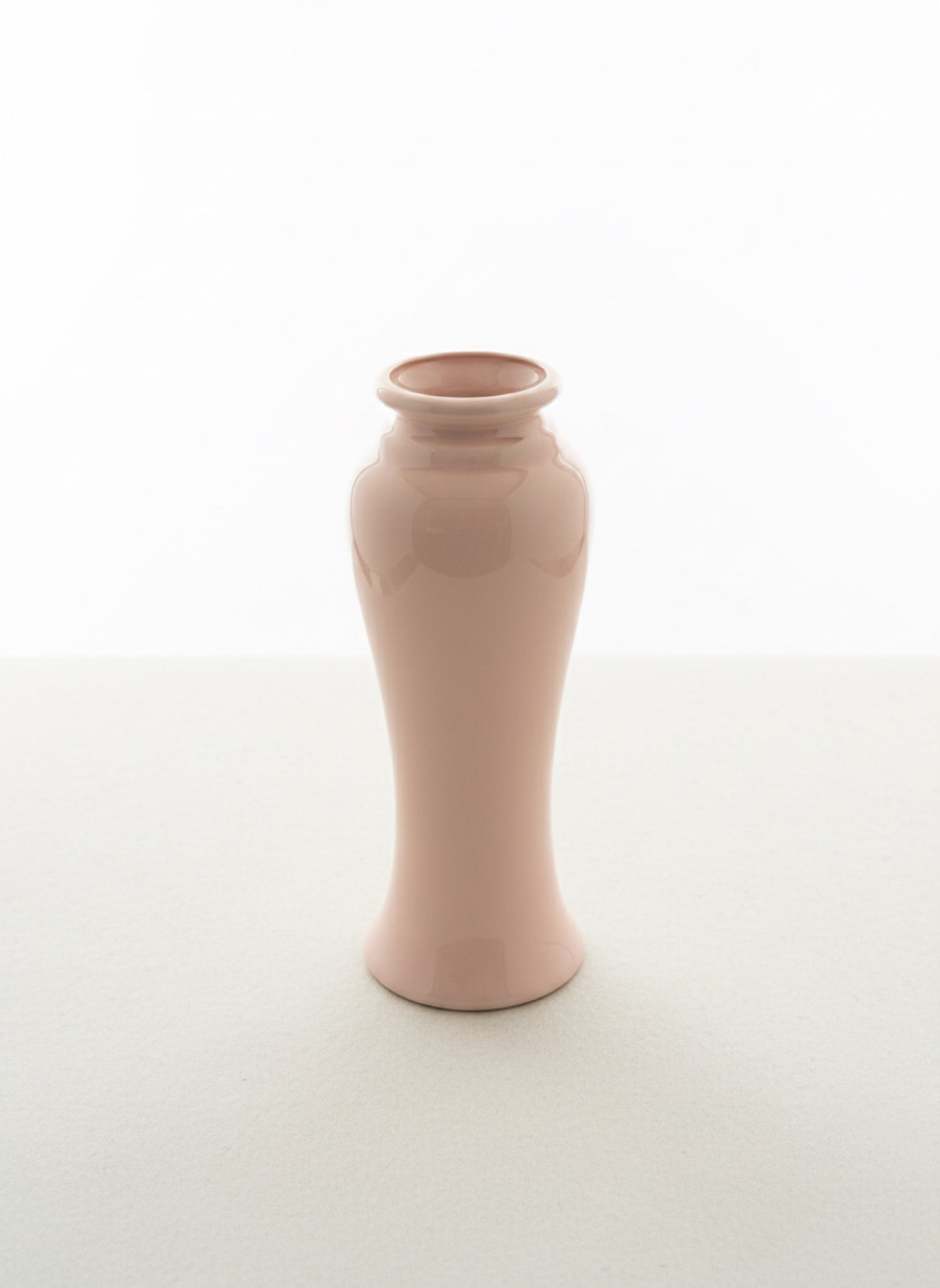 Pink ceramic vase on a white background