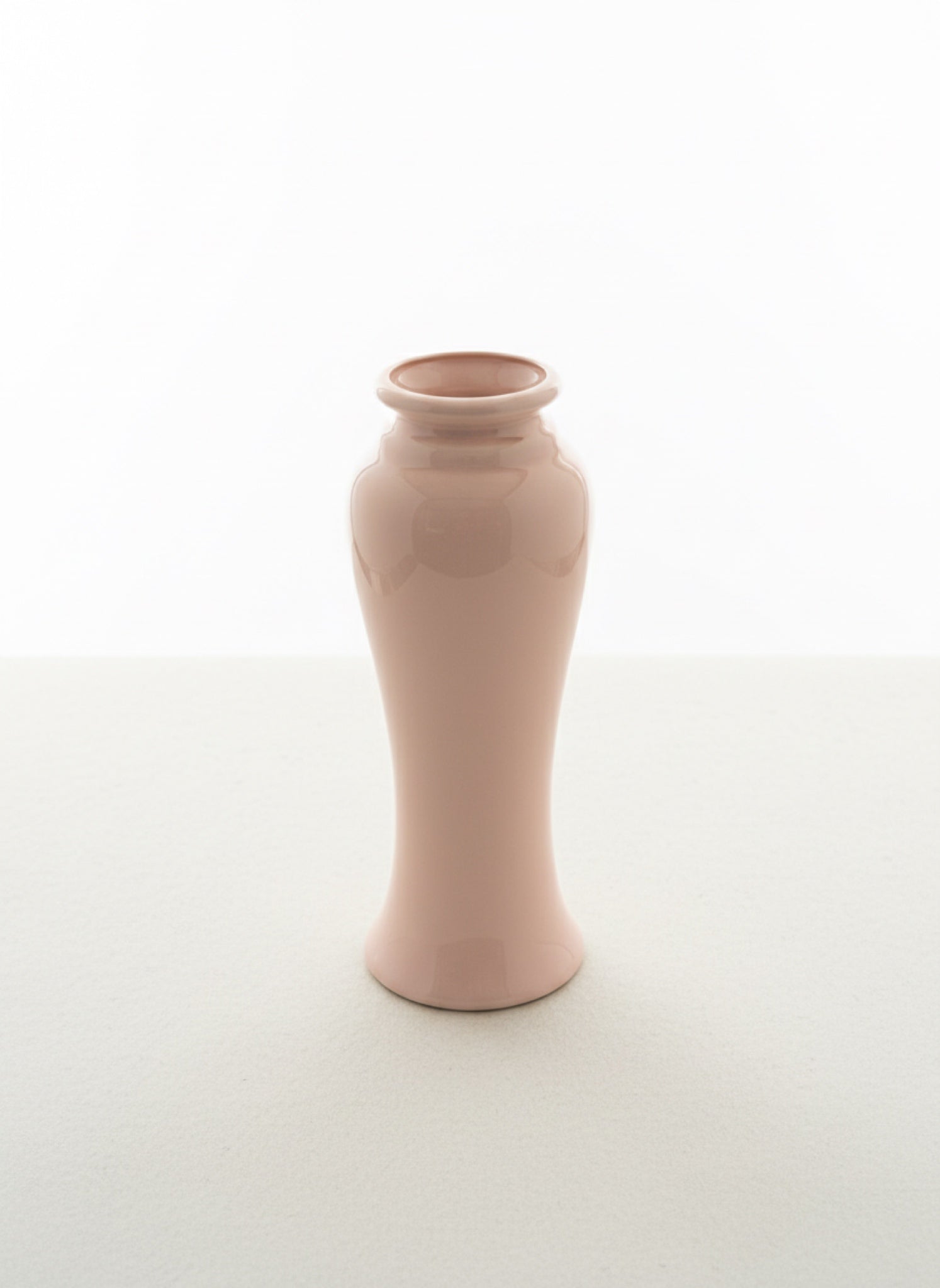 Pink ceramic vase on a white background
