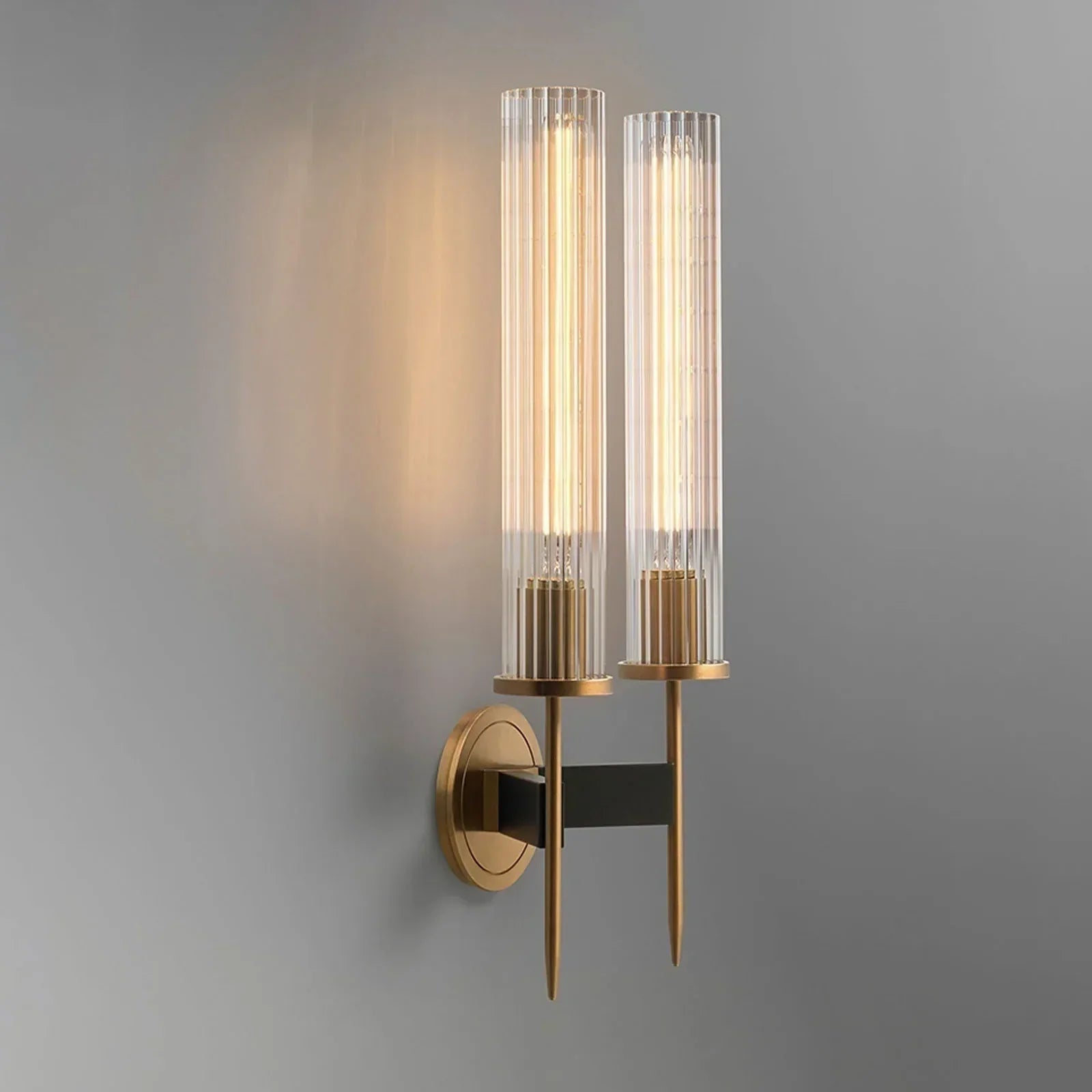 Modern wall sconce with glass shades on a gray background